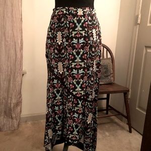 Earthbound hi-low maxi skirt. Patterns of rich vibrant color in a floral motif